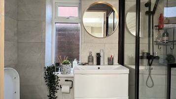 Shower, hair dryer, towels, soap