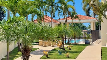 Enjoy the tropical greenery of the condominium's shared grounds.