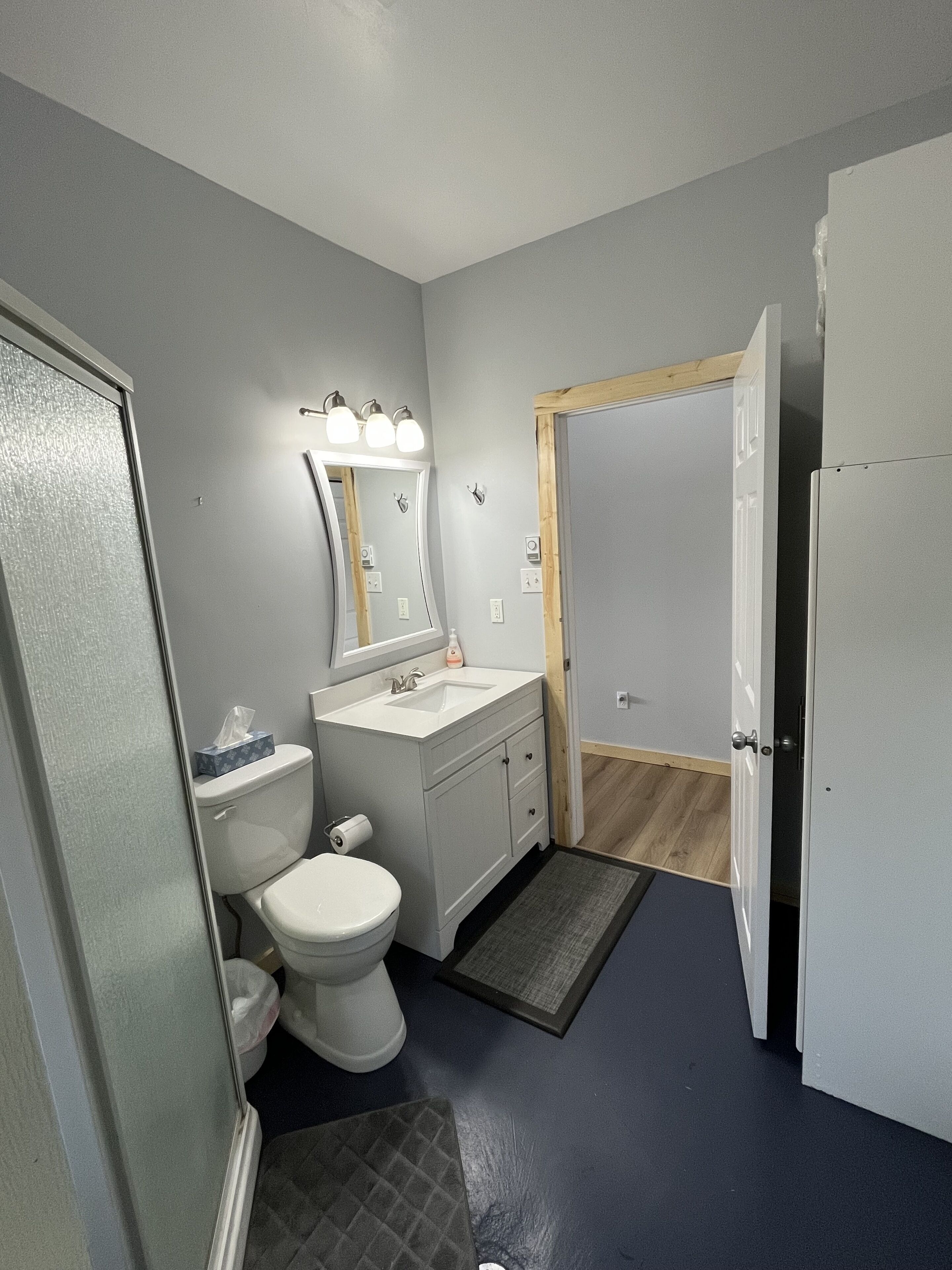 Shower, hair dryer, towels, toilet paper