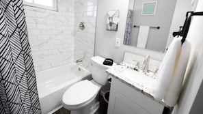 Shower, hair dryer, towels, shampoo