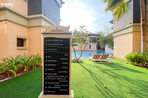 A signboard with hotel amenities and directions for Villa Clusters 44-49, 50-53, and Villas 54-66. - 1B-AnantaraSouth-G02 by bnbmehomes (Dubai)