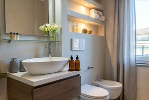 Shower, eco-friendly toiletries, hair dryer, bidet