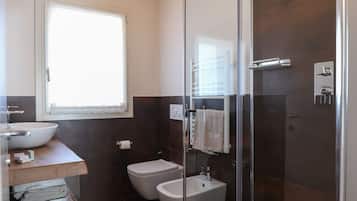 Deluxe Quadruple Room, Mountain View | Bathroom | Shower, rainfall showerhead, eco-friendly toiletries, hair dryer