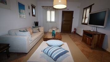 Exclusive Apartment | Living area | 42-inch Smart TV with digital channels, DVD player, pay films