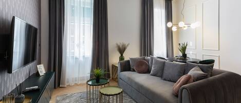 Departamento Deluxe | Área de sala de estar | Televisión LCD