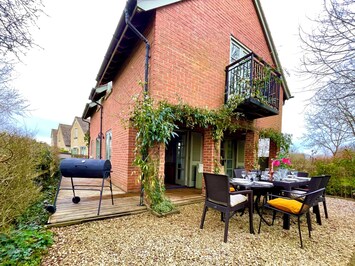 Rear of cottage for alfresco dining, BBQ with south facing aspect