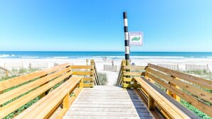 A wooden boardwalk leading to a beach with a sign indicating a lost children area. - 5 BR 2nd Row Beach House with a Private Pool! Beach Dreams (Surfside Beach)