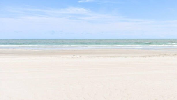 A beach with a clear sky and calm sea. - 4 BR 2nd Row Beach House with a Private Pool! Beachy Keen (Surfside Beach)
