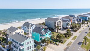 A coastal residential area with beachfront properties, a clear road, and a visible beach. - Oceanview 5 BR Beach House with a Private Pool! Blue Lagoon A (Surfside Beach)