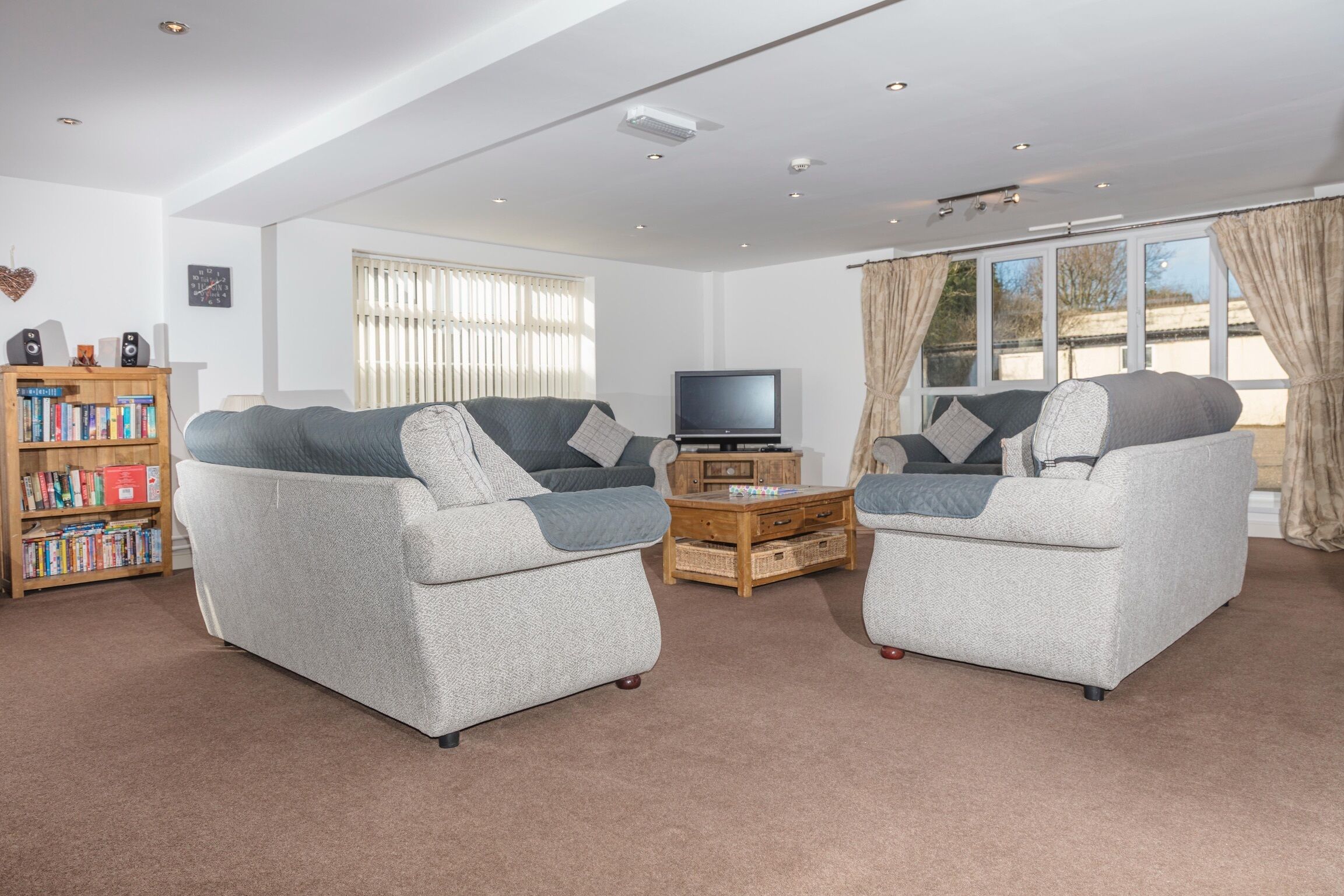 Comfort House | Living area | 15-inch flat-screen TV with digital channels, books, video library