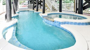 A swimming pool with a tiled edge and a separate hot tub area. - Oceanfront 5 BR Beach House with a Private Pool! La Dolce Vita (Surfside Beach)