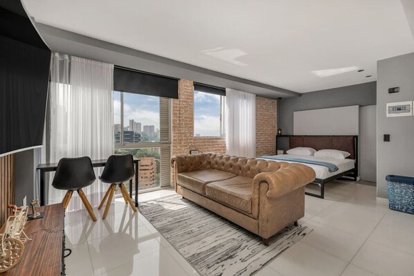 1 bedroom, desk, iron/ironing board, travel crib