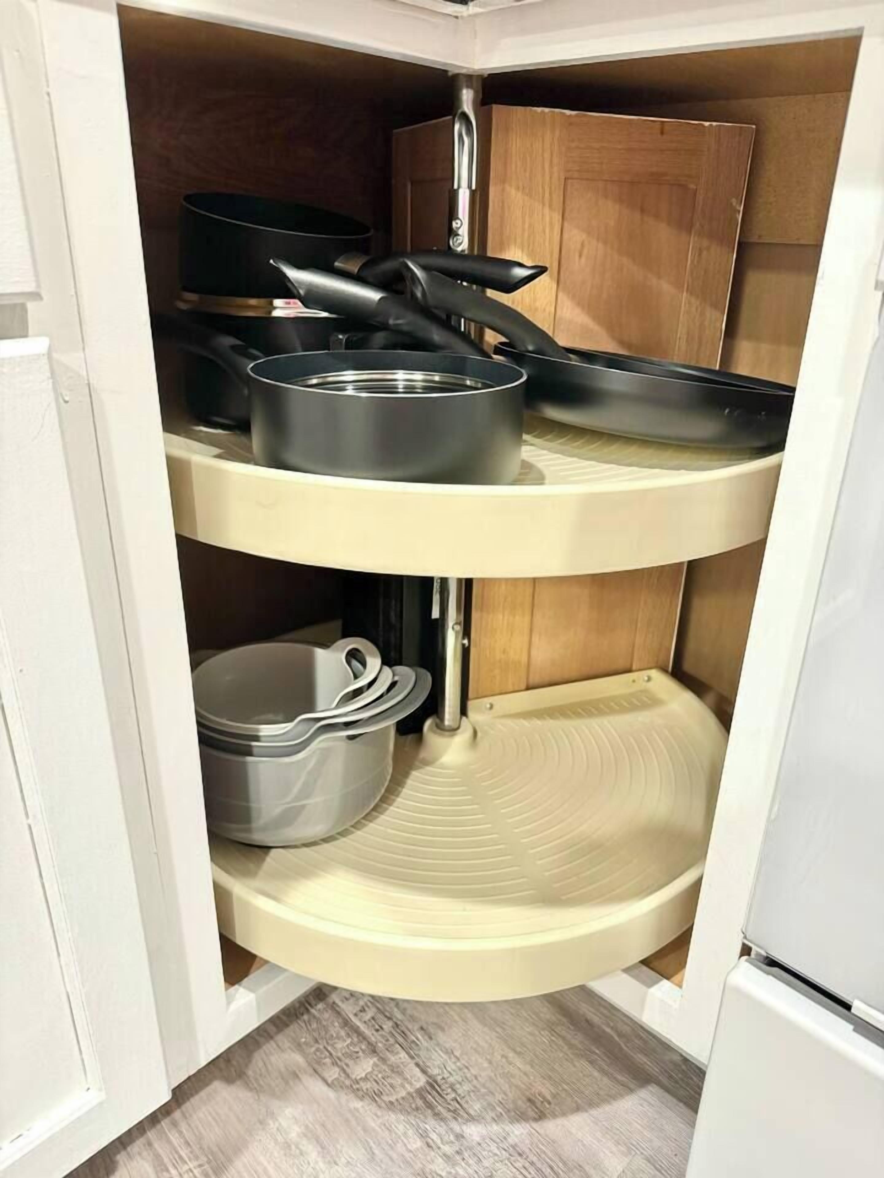A corner kitchen with a built-in stove, a sink, and a countertop.