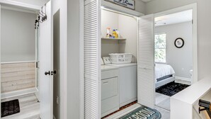 A laundry room with a sign indicating self-service and 24-hour availability. - Comfy Augusta Condo w/ Deck ~ 4 Mi to Olde Town (Augusta)