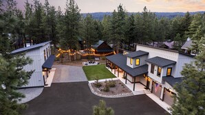 A residential area with multiple houses, a driveway, and a lawn. - LaborDay Avail-Cle Elums Best 4 Large Groups+Pool Access- 7BD/7BA + Slps 28 (Ronald)