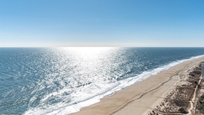 A beach with a clear sky and ocean waves. - Century One-2 Bedroom Ocean Oasis with Indoor Pool! (Ocean City)
