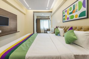Deluxe Room | In-room safe, desk, iron/ironing board, rollaway beds