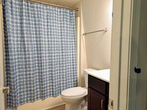 Shower, hair dryer, towels, toilet paper
