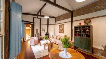 Deluxe House | Living area | Flat-screen TV, printers