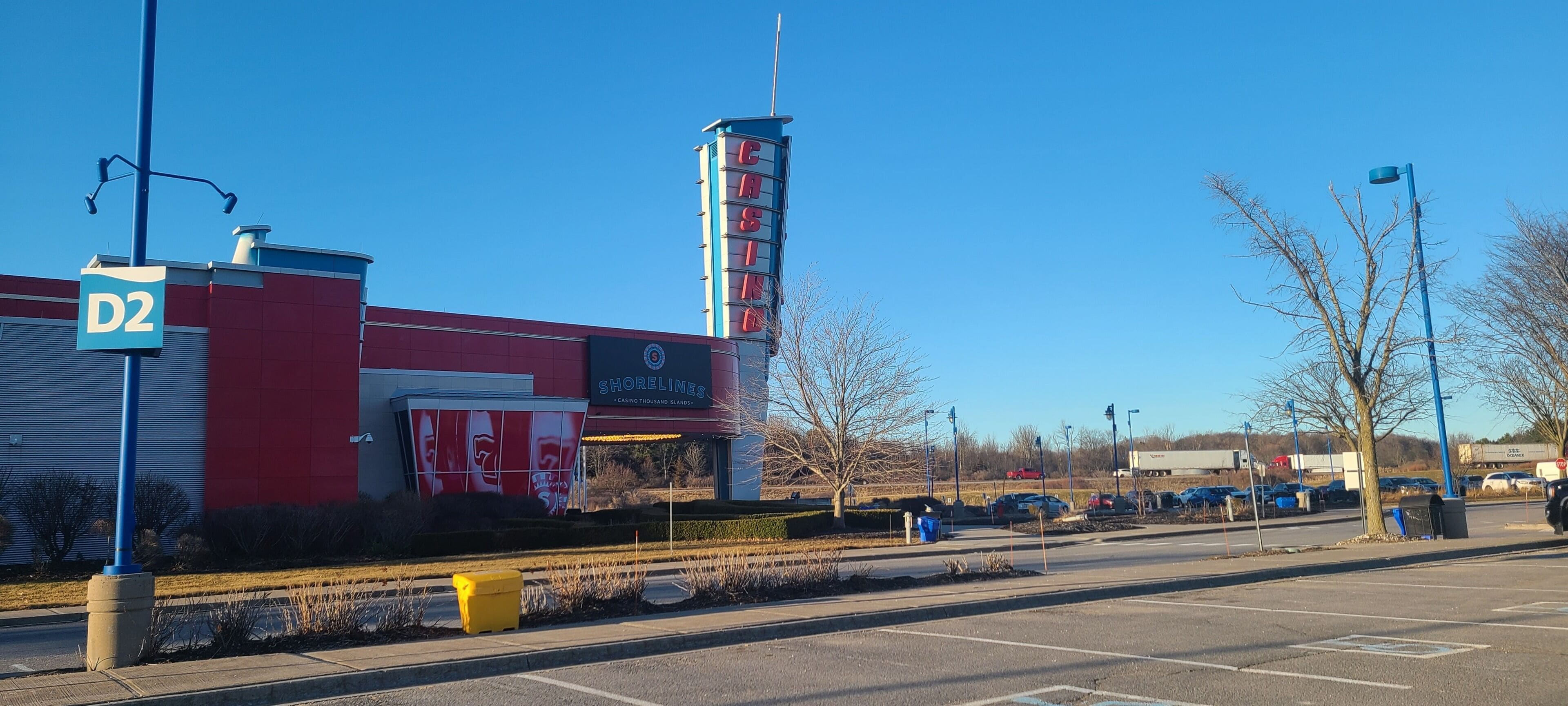 A building with a 'D2' sign, a tall tower with 'CASINO' signage, and a 'SHORELINE' banner.