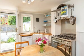 Fridge, microwave, oven, stovetop - Boatswains Cottage is a charming two-bedroom cottage, close enough to the sea to hear the gulls. (Whitstable)