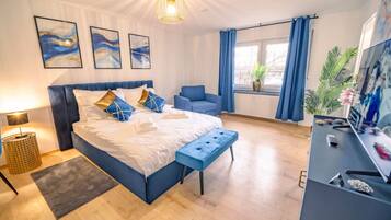 1 bedroom, desk, iron/ironing board, travel crib