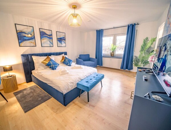 1 bedroom, desk, iron/ironing board, travel crib