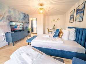 1 bedroom, desk, iron/ironing board, travel crib