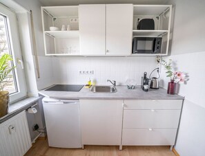 Fridge, microwave, stovetop, coffee/tea maker