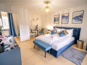 1 bedroom, desk, iron/ironing board, travel crib