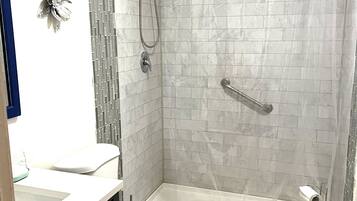 Shower, hair dryer, towels, soap