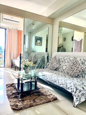 Standard Room - Tower A | Living area | Flat-screen TV