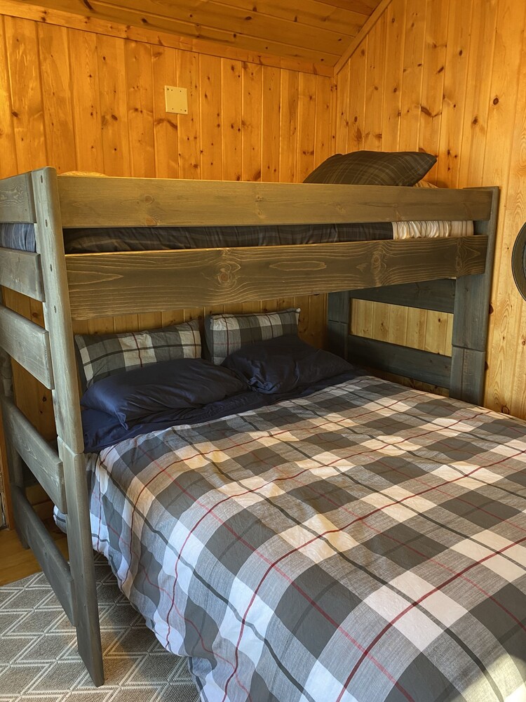 “Summerhouse” Surrounded by towering pines, big water views & sandy