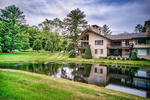 Situated beside a serene pond, this property offers a tranquil retreat with a spacious balcony overlooking lush greenery.