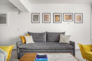 Apartment | Living area | 60-inch Smart TV with cable channels