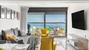 Apartment | Living area | 60-inch Smart TV with cable channels