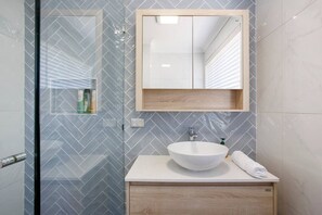 Shower, hair dryer, towels, soap
