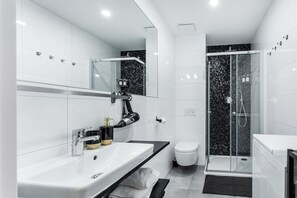 Shower, hair dryer, towels, soap