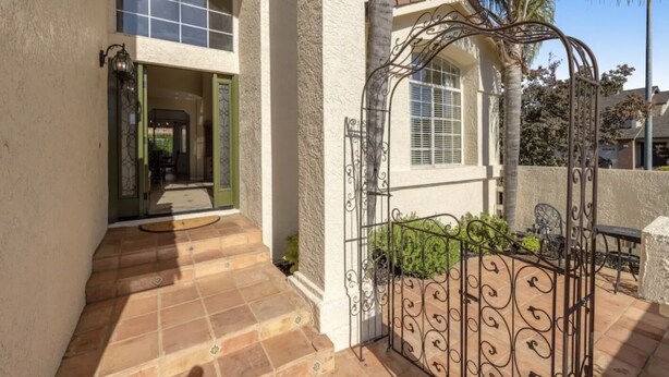 A house with a patio, a gate, and a door leading to the interior. - Beautiful Home in Northwest Napa

 (Napa)