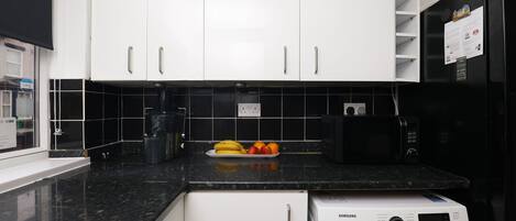 Executive Apartment | Private kitchen | Full-size fridge, dishwasher, electric kettle, cookware/dishes/utensils