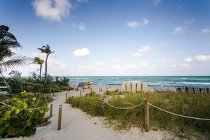 On the beach, sun-loungers, beach towels