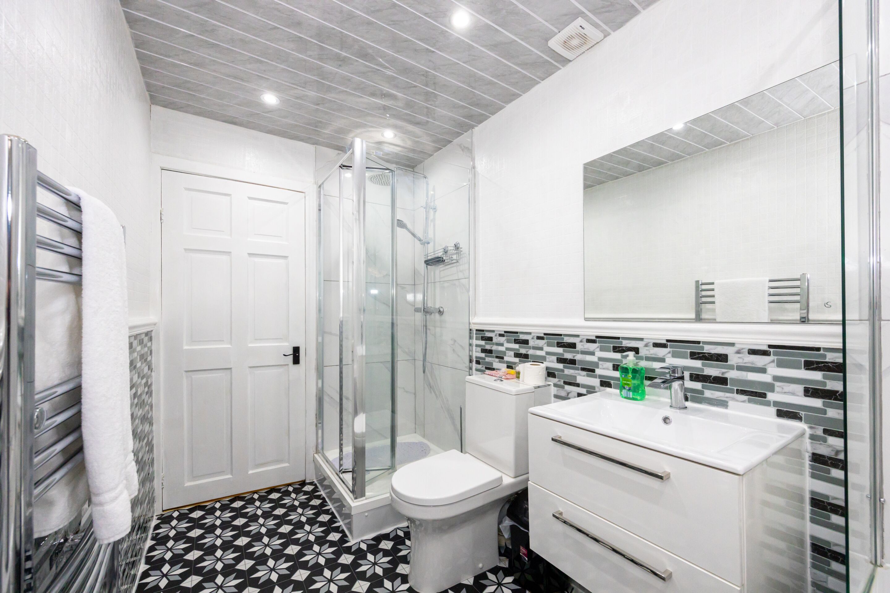 Shower, towels, soap, toilet paper
