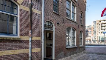 A brick building with a private entrance directly from the street.