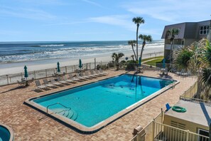 A swimming pool with a view of the beach and ocean. - Ground Floor, Ocean views, steps from the sand, High end vacation home (Saint Augustine Beach Florida)