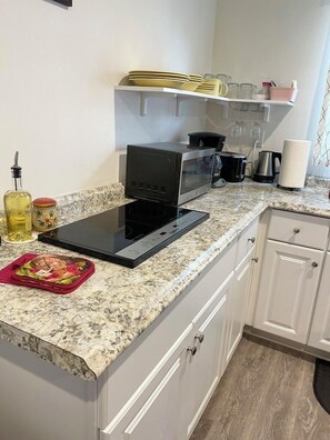 Fridge, microwave, stovetop, coffee/tea maker