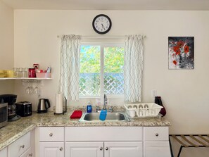Fridge, microwave, stovetop, coffee/tea maker