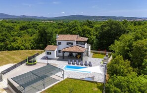 A two-story house with a swimming pool, a covered patio, and a playground. - Beautiful home in Labin (Labin)