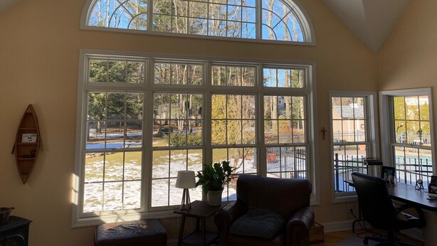 A room with a large arched window, a wooden boat on the wall, a desk, and a chair. - Saratoga retreat!  Great yard with inground pool.  4 miles from Racetrack. (Saratoga Springs)