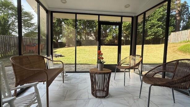 A covered patio with wicker furniture and a potted plant. - Wonderful 4B2.5B for Augusta Master Holiday (Evans)