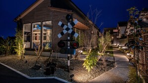 A building with a modern architectural design, featuring large windows and a crosswalk sign in front. - Kisyapoppo (Nakatsu)